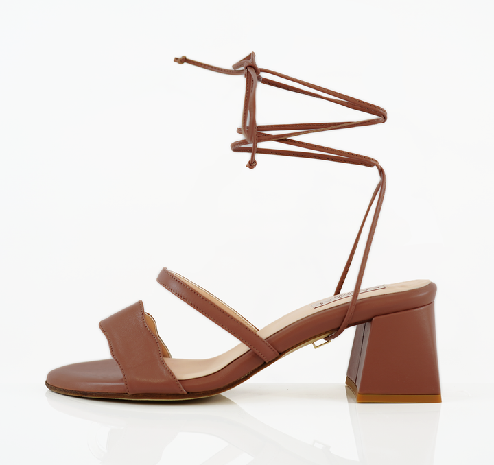 An Audrey Sandal shoe with a 50mm heel height and Kumasi shade and long straps